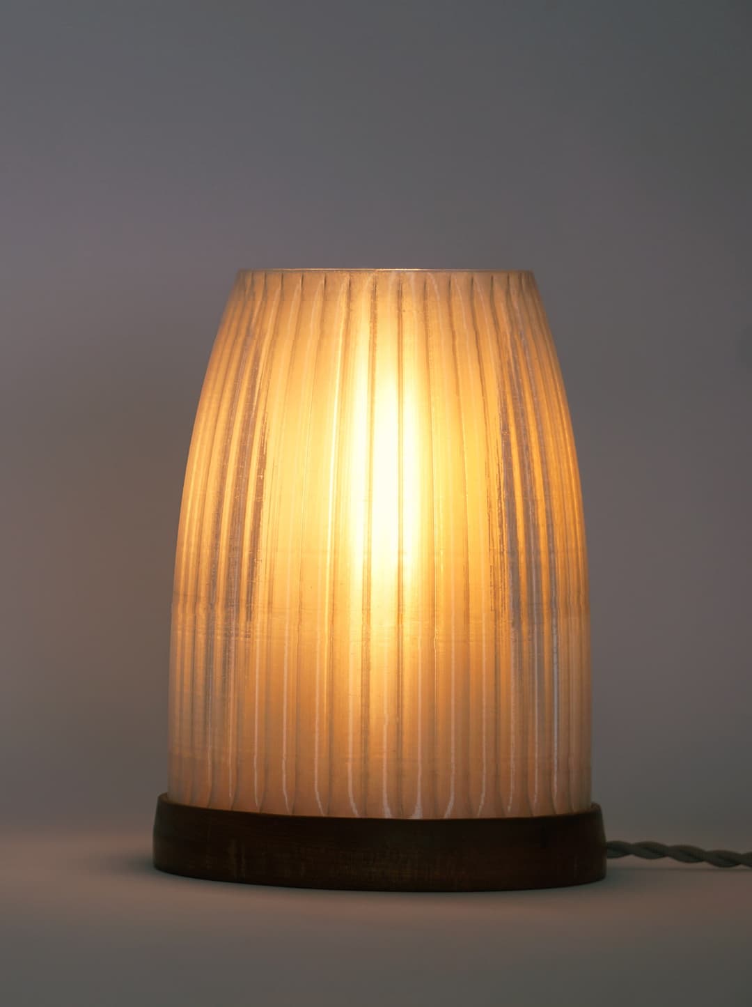 Image of a lamp  with the light turned on.